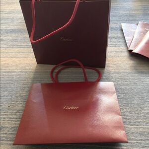 Two Cartier Shopping Bags